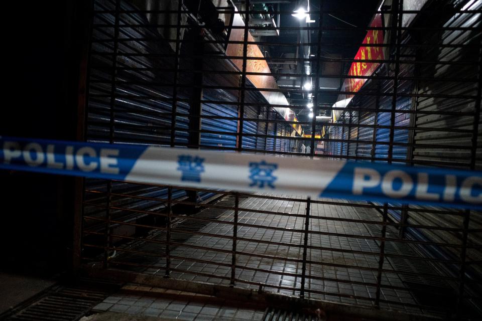 Members of staff of the Wuhan Hygiene Emergency Response Team conduct searches on the closed Huanan Seafood Wholesale Market in the city of Wuhan, in the Hubei Province, on January 11, 2020, where the Wuhan health commission said that the man who died from a respiratory illness had purchased goods. - China said on January 11, 2020 that a 61-year-old man had become the first person to die from a respiratory illness believed to be caused by a new virus from the same family as SARS (Sudden Acute Respiratory Syndrome), which claimed hundreds of lives more than a decade ago. Forty-one people with pneumonia-like symptoms have so far been diagnosed with the new virus in Wuhan, with one of the victims dying on January 8, 2020, the central Chinese city's health commission said on its website. (Photo by NOEL CELIS / AFP) (Photo by NOEL CELIS/AFP via Getty Images)