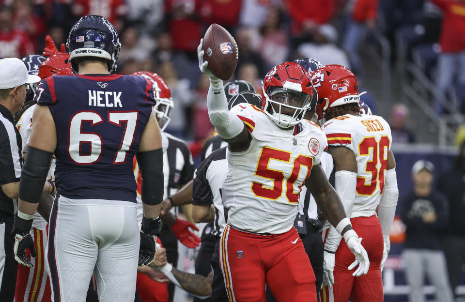 Dec 18, 2022; Houston, Texas, USA; Kansas City Chiefs linebacker Willie Gay (50) celebrates after the Chiefs recovered a fumble during overtime against the Houston Texans at NRG Stadium. Mandatory Credit: Troy Taormina-USA TODAY Sports