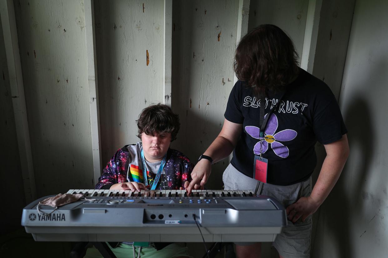 Katie Jo Robinson (right) works on a keyboard melody with camper Ash Humbert during Girls Rock! Indianapolis summer camp Thursday, July 22, 2021, at Camp Sertoma in Indianapolis. 