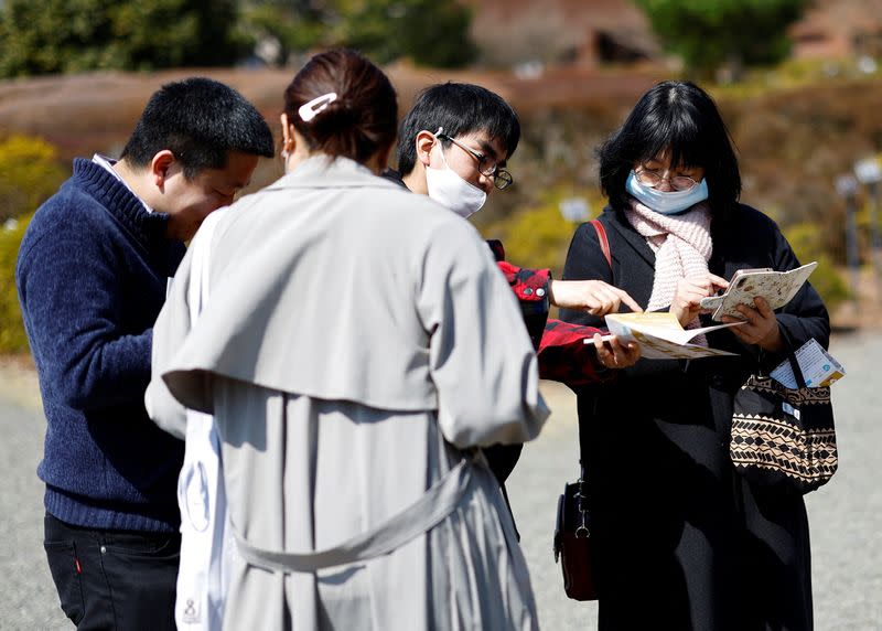 Participants take part in a matchmaking event using mystery solving game, which is organized by Tokyo metropolitan government at Jindai Botanical Gardens in Tokyo