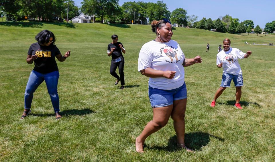 Women dance at Kiwanis Park during Juneteenth in Sheboygan.