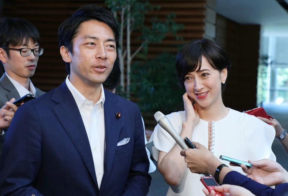 From left: Japanese environment minister Shinjirō Koizumi and Koizumi's wife, TV host Christel Takigawa, speak to the media in Tokyo. | STR/JIJI PRESS/AFP via Getty