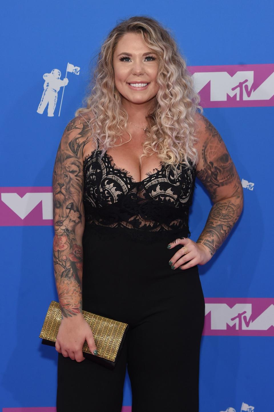 Kailyn Lowry sports an amazing black jumpsuit that leaves nothing to imagination in her cleavage area
