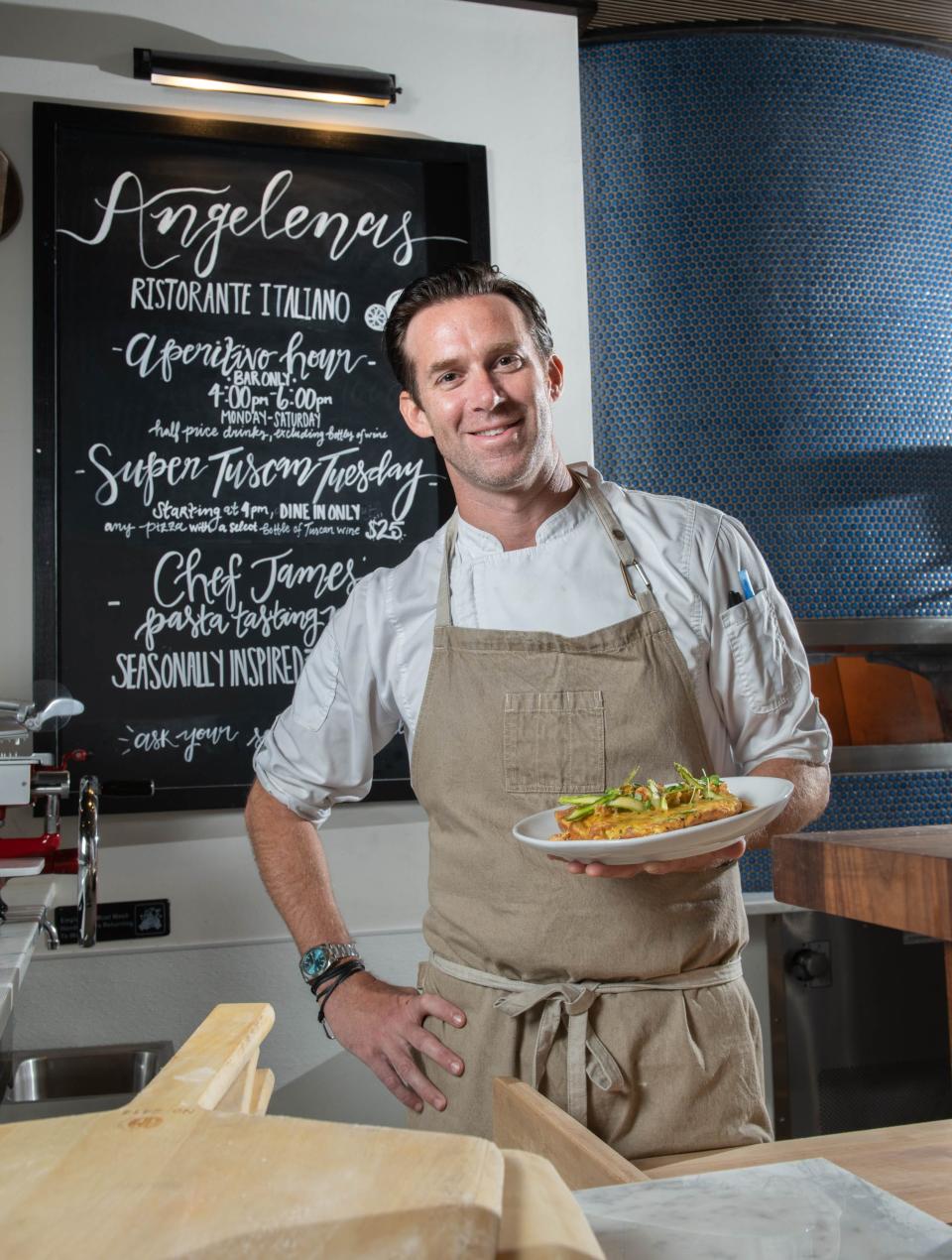 Executive Chef James Briscione holds an Asparagus Frittata with Crawfish Beurre Blanc - one of two Easter specials - at Angelena's Ristorante Italiano in downtown Pensacola on Friday, March 24, 2023.