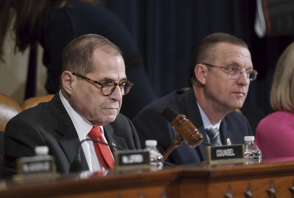 House Judiciary Committee Chairman Jerrold Nadler, D-N.Y., left, joined by Rep. Doug Collins, R-Ga., the ranking member, using his gavel to call for order as he convenes a hearing to hear investigative findings in the impeachment inquiry against President Donald Trump, on Capitol Hill in Washington, Monday, Dec. 9, 2019. (AP Photo/J. Scott Applewhite)