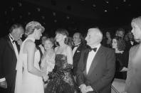 <p>At the same event, famed director Lindsay Anderson greeted the royal in a simple tuxedo and black bow tie. </p>