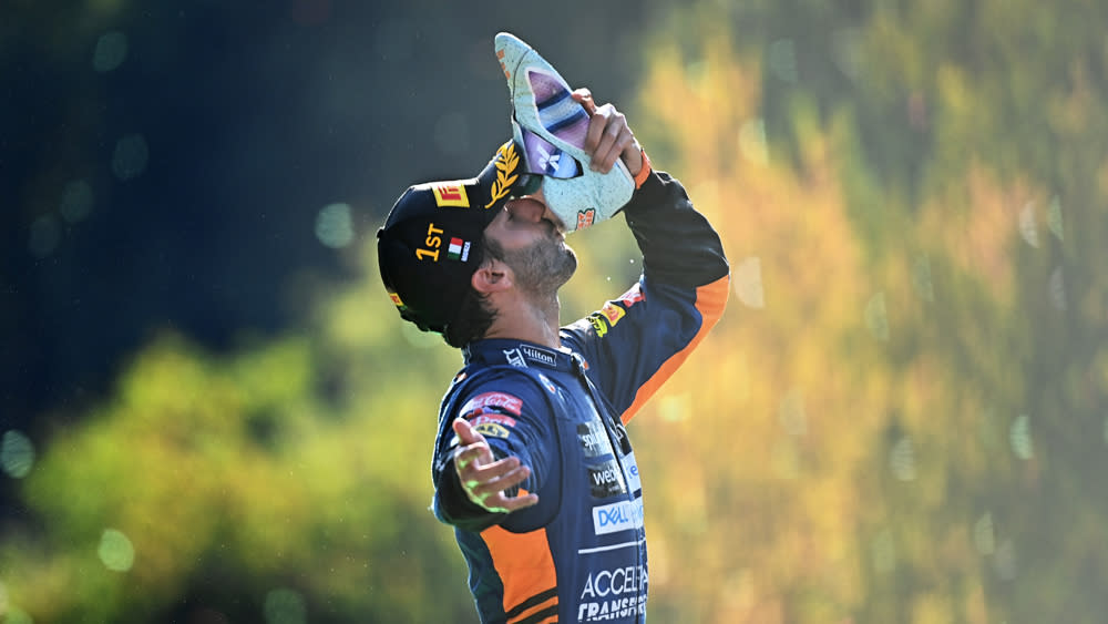 Ricciardo has made the shoey a podium tradition. - Credit: Clive Mason - Formula 1/Formula 1 via Getty Images