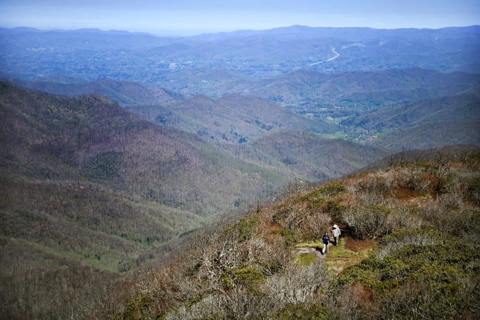 Claire and Dave Davis, of West Virginia, make their way to the top of the Craggy Pinnacle on the Blue Ridge Parkway on April 22, 2019. 