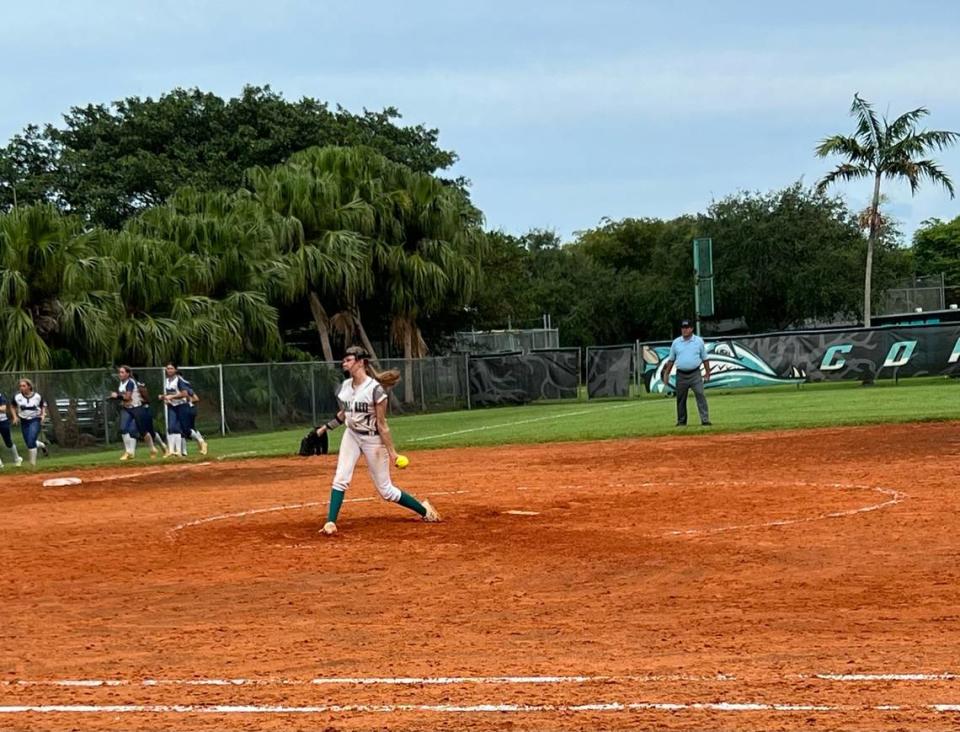 Coral Reef pitcher Quin Wylie throws a warmup toss in between innings during the Barracudas’ 7-1 loss to Boca Raton Spanish River on Friday at Coral Reef.