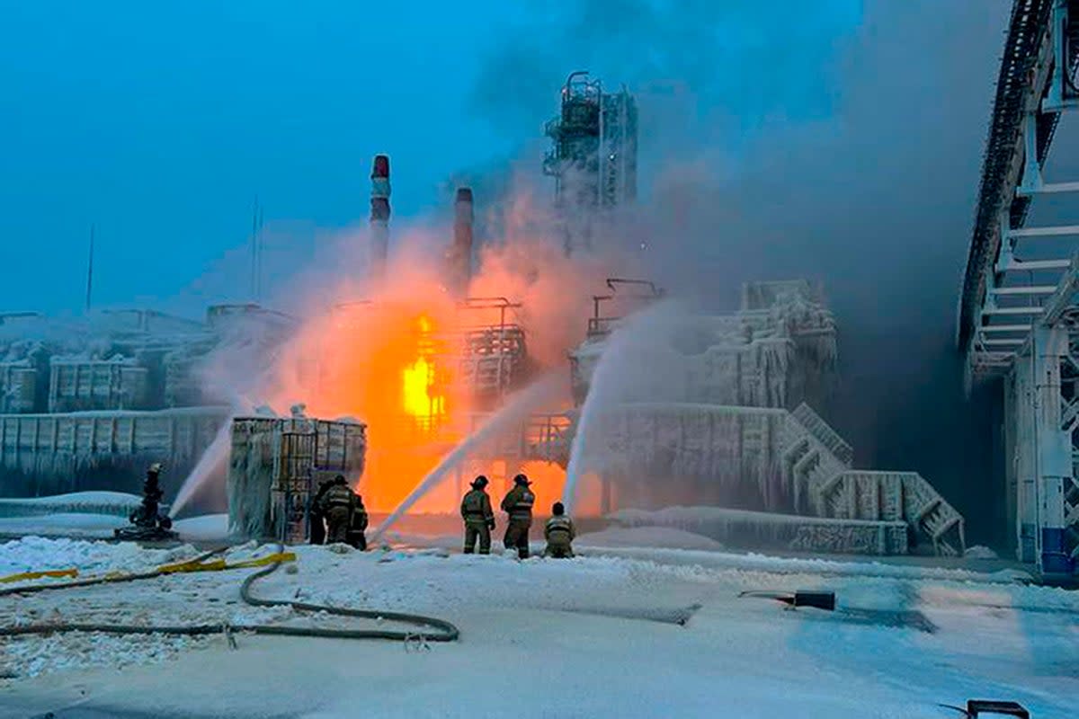 Fire fighters extinguish the blaze at Russia's second-largest natural gas producer, Novatek (AP)