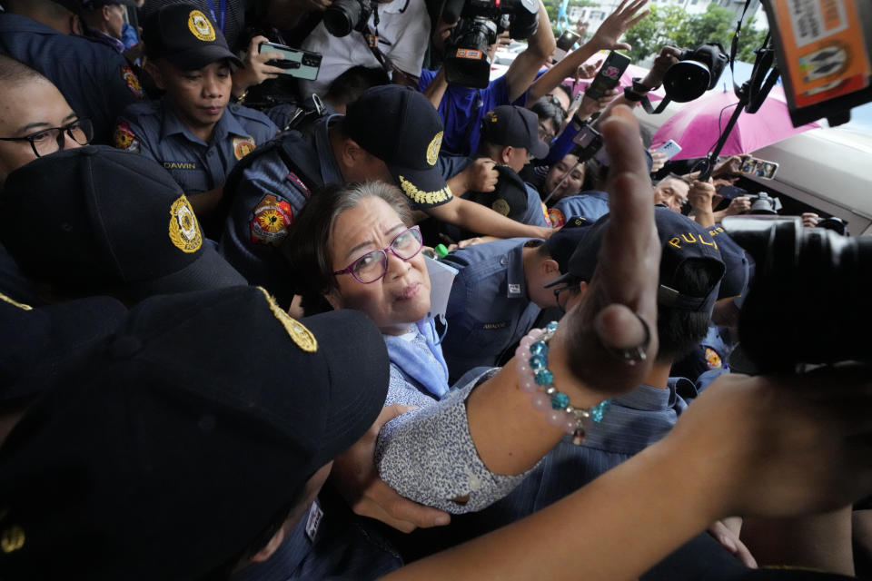 Former Senator Leila de Lima reacts after she goes out of the Muntinlupa City trial court on Monday, Nov. 13, 2023 in Muntinlupa, Philippines. A Philippine court on Monday ordered the release on bail of the former senator jailed more than six years ago on drug charges she said were fabricated to muzzle her investigation of then-President Rodrigo Duterte’s brutal crackdown on illegal drugs. Two other non-bailable drug cases against de Lima have been dismissed. (AP Photo/Aaron Favila)