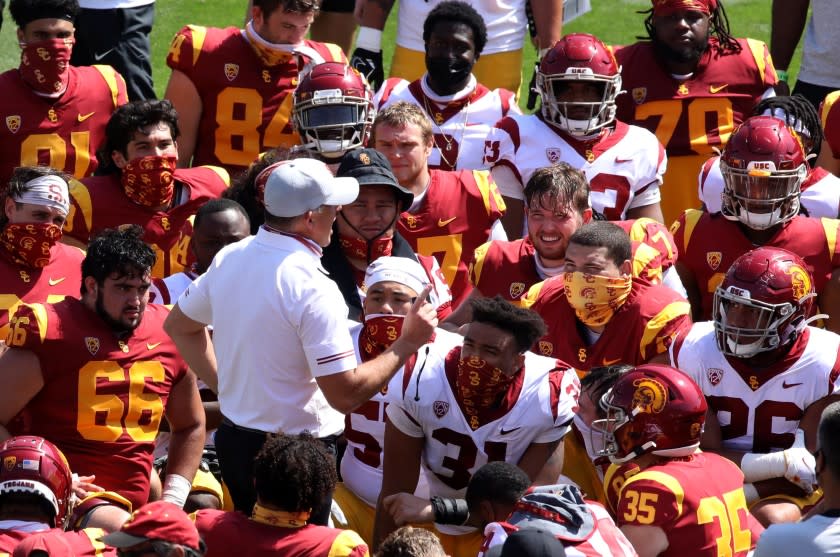 LOS ANGELES, CA - APRIL 17, 2021 - - USC's coach Clay Helton talks to players at the end of USC's Spring Football Game.