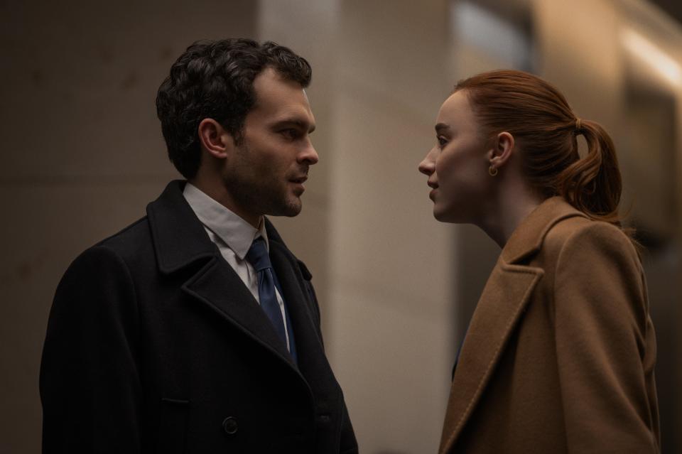 In Netflix's new movie "Fair Play" (now streaming), Emily (Phoebe Dynevor, right) gets promoted in lieu of her fiancée Luke (Alden Ehrenreich, left) at their demanding financial firm.