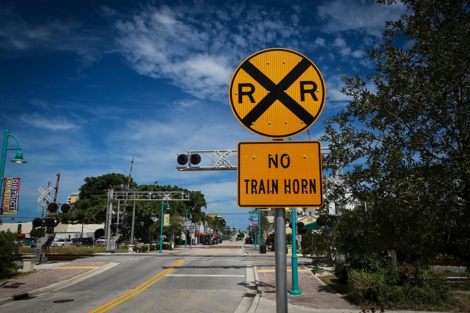 A "No Train Horn" sign sits next to the railroad tracks on East Ocean Avenue in Boynton Beach.