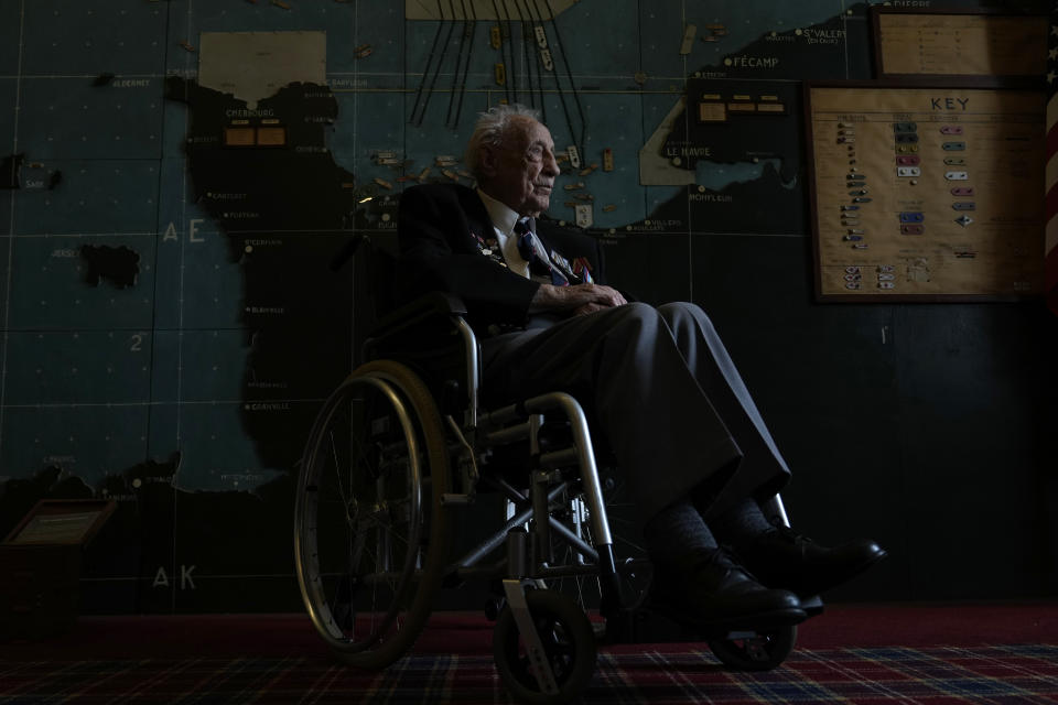 British Normandy campaign veteran Les Underwood of the Royal Navy poses in the 'Map Room' which shows the large diagram of the D-Day Invasion, at Southwick army base near Portsmouth, England, Monday, June 3, 2024. Underwood is part of a group of veterans travelling to France for the 80th anniversary commemoration of the D-Day Invasion.(AP Photo/Alastair Grant)
