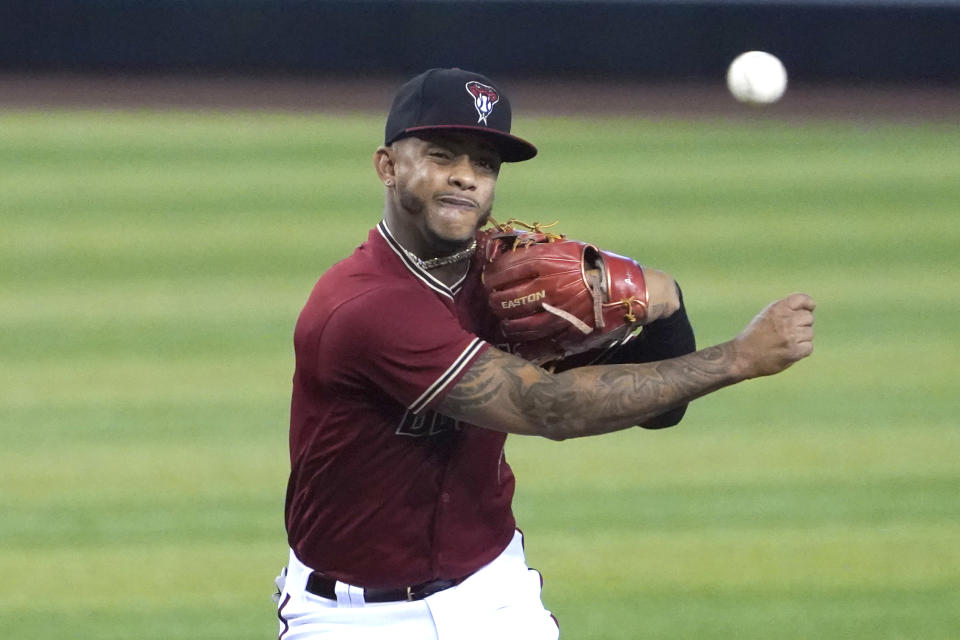 Arizona Diamondbacks second baseman Ketel Marte makes a throw for an out on a ball hit by San Diego Padres' Fernando Tatis Jr. in the first inning during a baseball game, Sunday, Aug 16, 2020, in Phoenix. (AP Photo/Rick Scuteri)