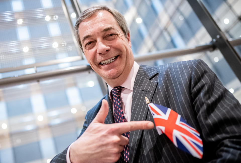 29 January 2020, Belgium, Brüssel: Nigel Farage (Brexite Party), with a small Great Britain flag, confronts the photographer after he had left the plenary after his speech. Two days before Britain's withdrawal from the European Union, the European Parliament also wants to ratify the EU withdrawal agreement at a meeting in Brussels and finally seal the brexit. Photo: Michael Kappeler/dpa (Photo by Michael Kappeler/picture alliance via Getty Images)