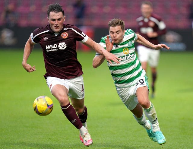 John Souttar, left, and Celtic’s James Forrest battle for the ball 