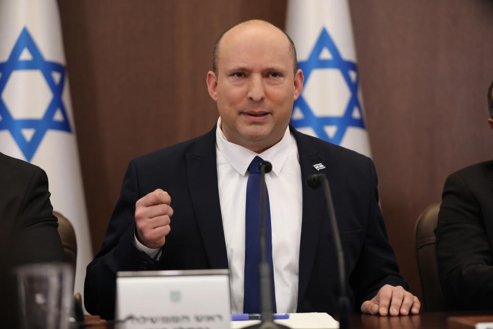 Israeli Prime Minister Naftali Bennett, center, attends a cabinet meeting at the prime minister's office in Jerusalem, Sunday, May 15, 2022. (Abir Sultan/Pool Photo via AP)