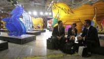 Delegates take a break during the opening day of the World Climate Change Conference 2015 (COP21) at Le Bourget, near Paris, France, November 30, 2015. REUTERS/Jacky Naegelen