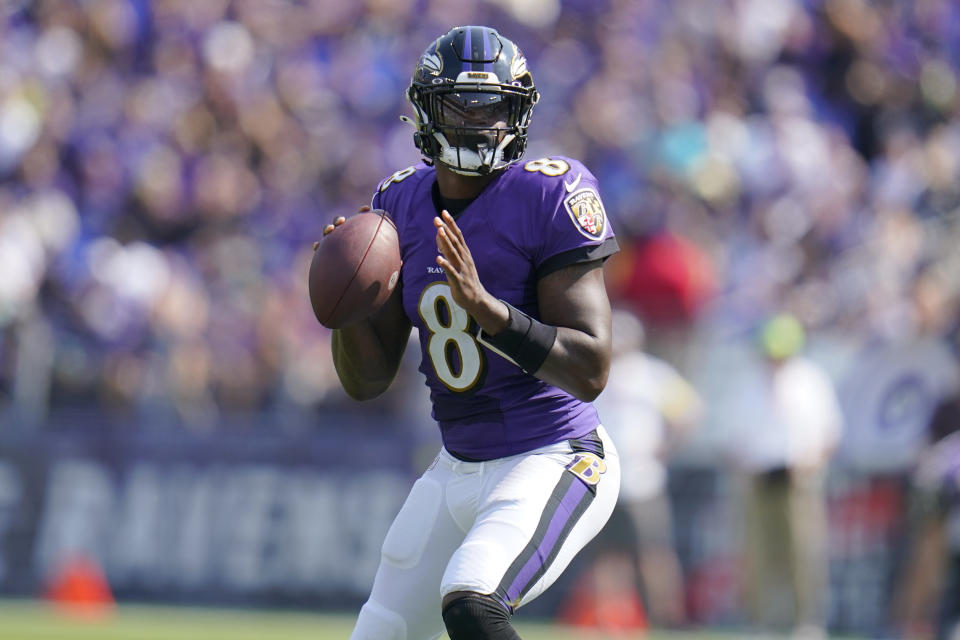 Baltimore Ravens quarterback Lamar Jackson (8) aims a pass during the first half of an NFL football game against the Miami Dolphins, Sunday, Sept. 18, 2022, in Baltimore. (AP Photo/Julio Cortez)