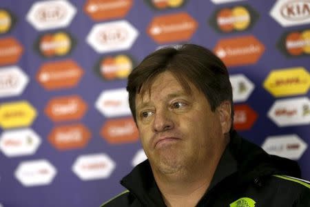 gestures during a news conference, ahead of the Copa America soccer tournament at Estadio El Teniente in Rancagua, Chile June 18, 2015. REUTERS/Carlos Garcia Rawlins