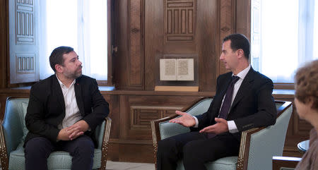 Syria's President Bashar al-Assad (R) meets with European Parliament delegation headed by Javier Couso (L), vice-president of the European parliamentary committee on foreign affairs, in Damascus, Syria, in this handout picture provided by SANA on July 10, 2016. SANA/Handout via REUTERS