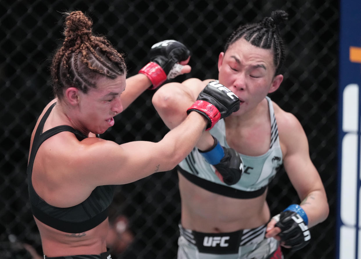 LAS VEGAS, NEVADA - OCTOBER 01: (R-L) Yan Xiaonan of China elbows Mackenzie Dern in a strawweight fight during the UFC Fight Night event at UFC APEX on October 01, 2022 in Las Vegas, Nevada. (Photo by Jeff Bottari/Zuffa LLC)