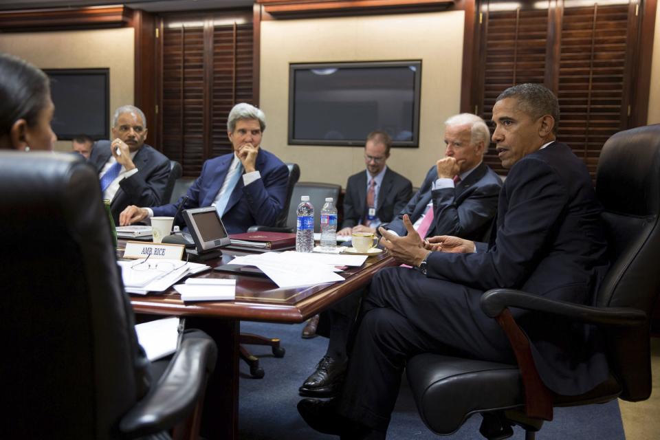 U.S. President Barack Obama (R) meets with his national security staff to discuss the situation in Syria in the Situation Room of the White House in Washington, in this photo taken August 30, 2013, courtesy of the White House. Others in the picture include (from L-R) National Security Advisor Susan Rice, Attorney General Eric Holder, Secretary of State John Kerry and Vice President Joe Biden. Obama's top advisers were to make their case for limited military strikes against Syria to the full Senate on Saturday, presenting evidence of a chemical weapons attack last week that the White House says killed more than 1,400 people. Picture taken August 30, 2013. REUTERS/Pete Souza/White House/Handout via Reuters (UNITED STATES - Tags: POLITICS CONFLICT TPX IMAGES OF THE DAY) ATTENTION EDITORS - THIS IMAGE WAS PROVIDED BY A THIRD PARTY. FOR EDITORIAL USE ONLY. NOT FOR SALE FOR MARKETING OR ADVERTISING CAMPAIGNS. THIS PICTURE IS DISTRIBUTED EXACTLY AS RECEIVED BY REUTERS, AS A SERVICE TO CLIENTS