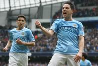 Samir Nasri (right) celebrates scoring Manchester City's second goal against Southampton at the Etihad Stadium in Manchester, northwest England, on April 5, 2014