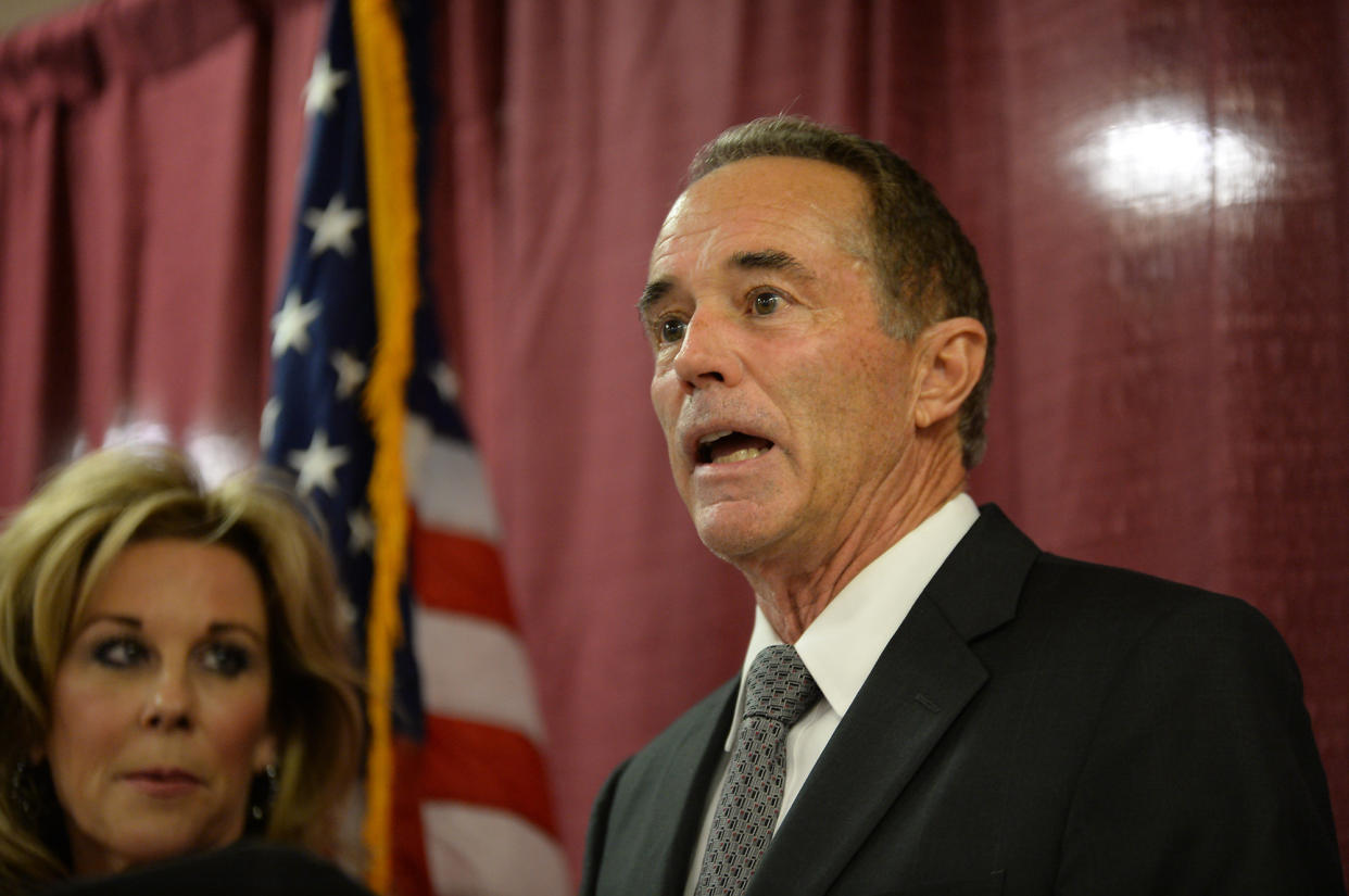 Rep. Chris Collins (R-N.Y.), with his wife Mary at his side, holds a news conference on Aug. 8, 2018, in Buffalo, New York, in response to his indictment for insider trading. (Photo: John Normile/Getty Images)