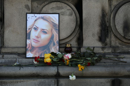 Flowers and candles are placed in memory of Bulgarian TV journalist Viktoria Marinova in Ruse, Bulgaria, October 9, 2018. REUTERS/Stoyan Nenov