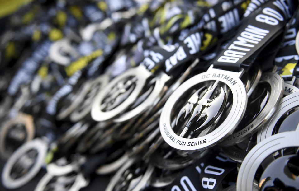 Medals are displayed at the end of the Batman Inaugural 5K run on Batman's 80th anniversary at Grand Park on Saturday, Sept. 21, 2019, in Los Angeles. (Keith Birmingham/The Orange County Register via AP)