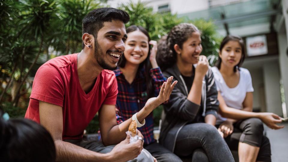 group of students joking and getting to know each other