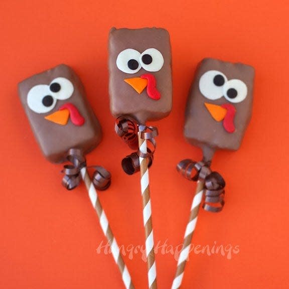 Chocolate dipped Rice Krispies treat turkey pops from Hungry Happenings