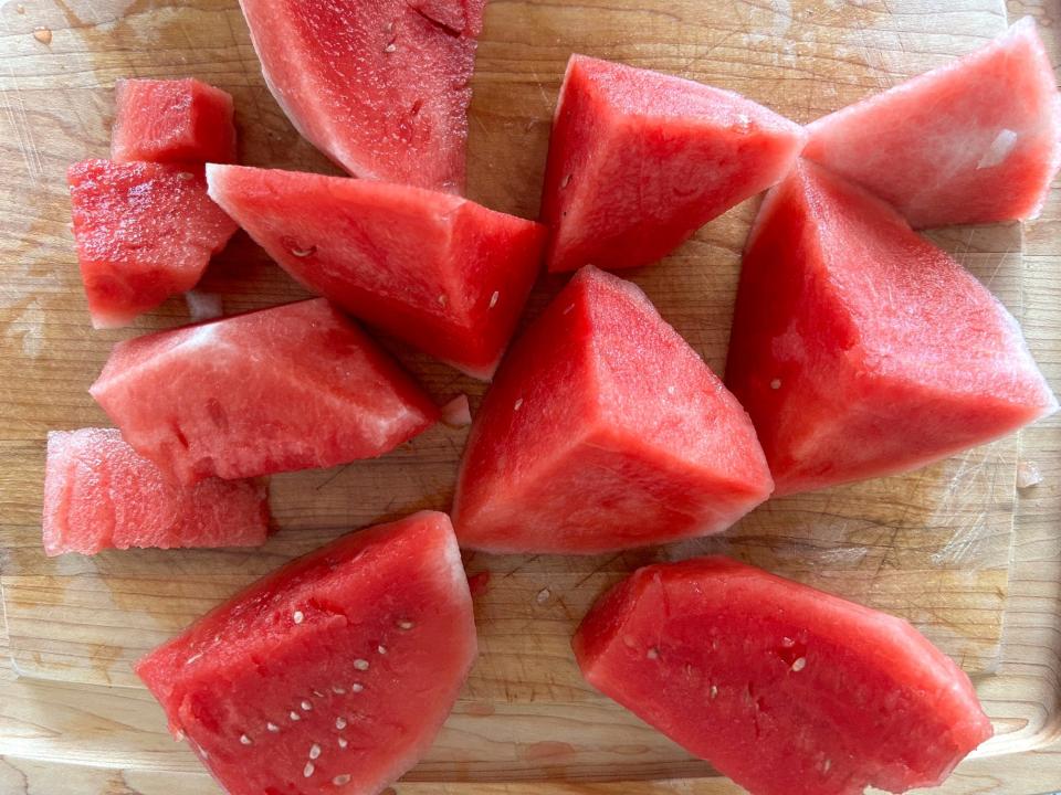 Cutting up watermelon for Ina Garten's watermelon cosmo