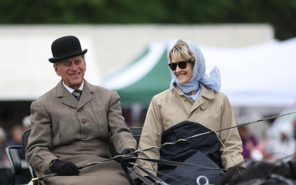 Penelope Knatchbull riding beside the Duke of Edinburgh in 2009 - Steve Parsons/PA