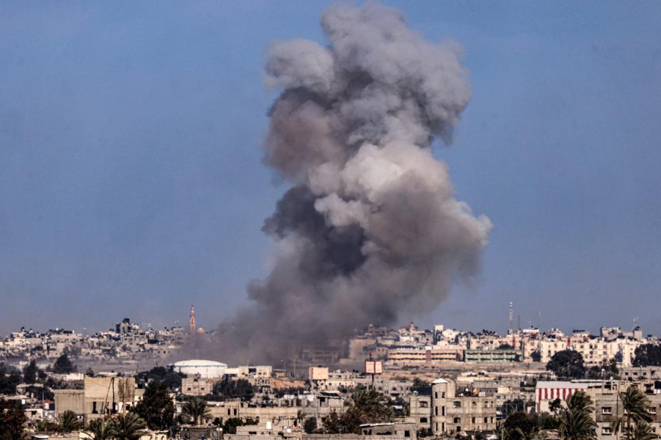 Smoke billows over buildings in southern Gaza following Israeli airstrikes (AFP via Getty)