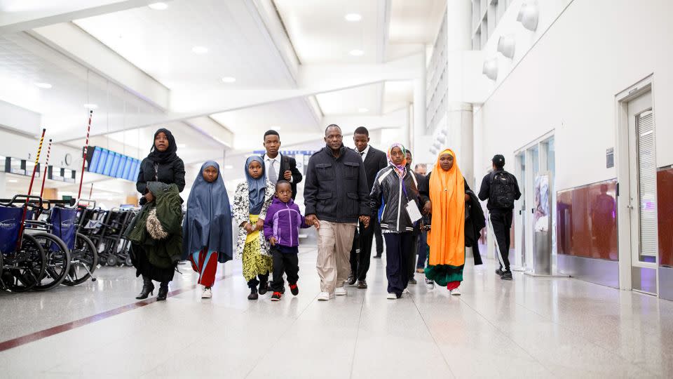 The Munye family walks through Atlanta's Hartsfield-Jackson International Airport. I followed their story for weeks after the Trump administration's travel ban went into effect, and continued visiting them regularly for more than a year. - Melissa Golden/Redux