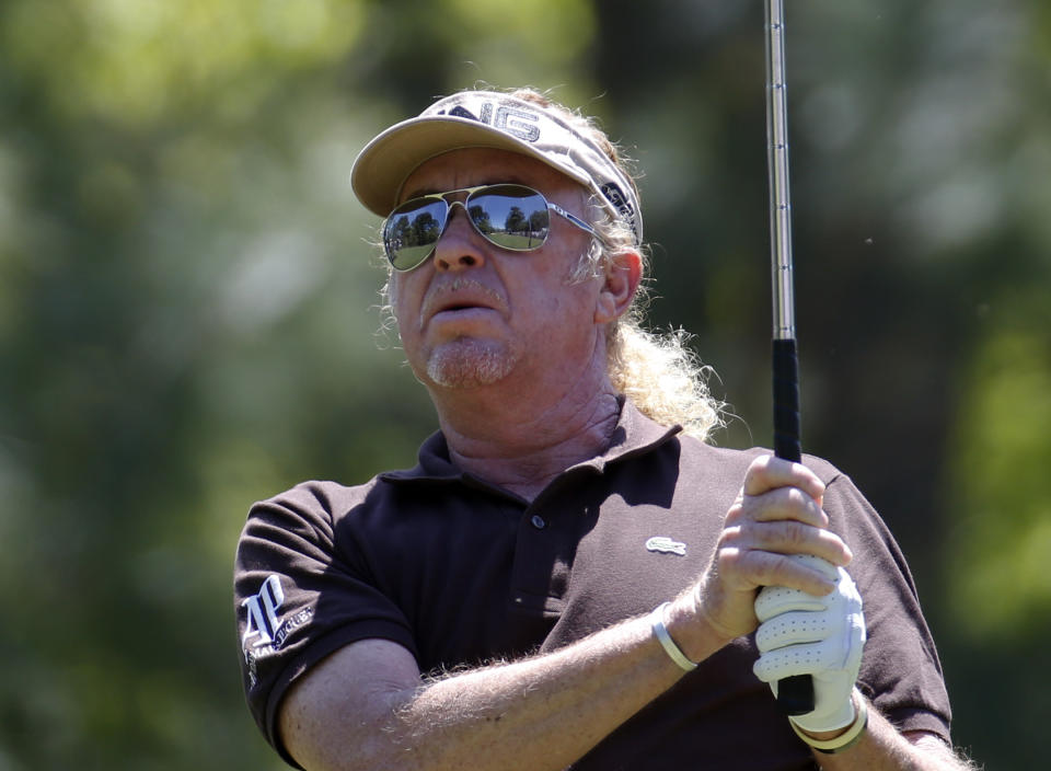 Miguel A. Jimenez hits from they tee on the second hole during the final round of play in the Greater Gwinnett Championship golf tournament of the Champions Tour, Sunday, April 20, 2014, in Duluth, Ga. (AP Photo/John Bazemore)