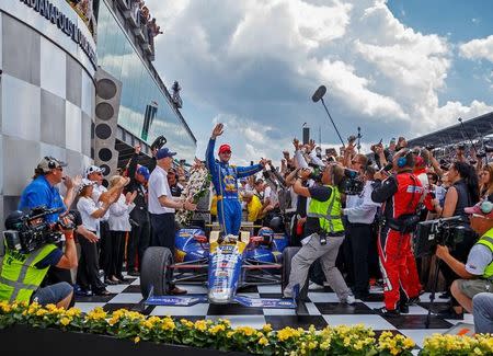 May 29, 2016; Indianapolis, IN, USA; IndyCar Series driver Alexander Rossi celebrates after winning the 100th running of the Indianapolis 500 at Indianapolis Motor Speedway. Mandatory Credit: Mark J. Rebilas-USA TODAY Sports