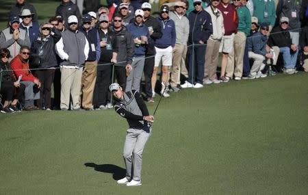 Danny Willett of England chips to the second green in second round play during the 2017 Masters golf tournament at Augusta National Golf Club in Augusta, Georgia, U.S., April 7, 2017. REUTERS/Lucy Nicholson