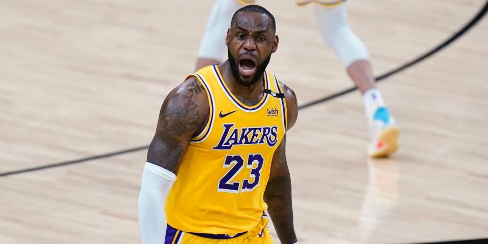 LeBron James yells during a game in 2021.