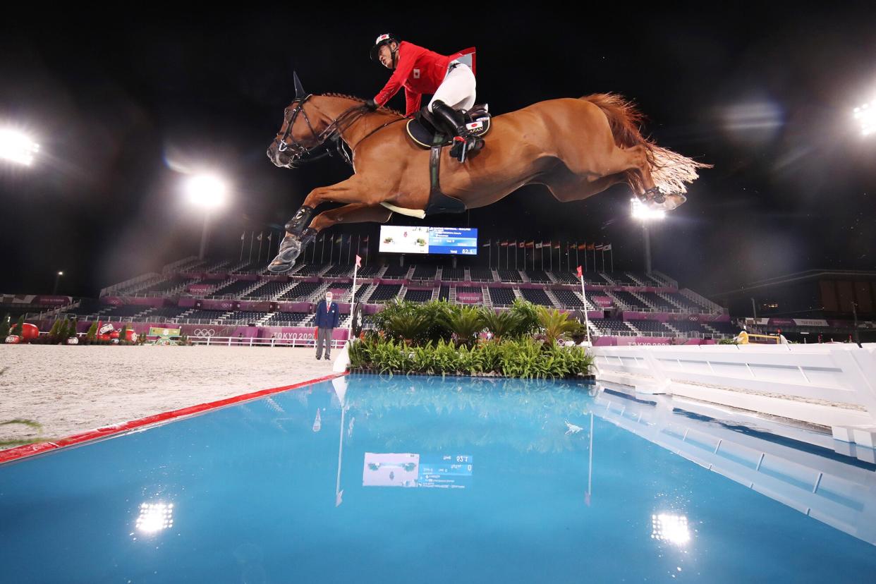 TOKYO, JAPAN - AUGUST 03: Daisuke Fukushima of Team Japan riding Chanyon competes during the Jumping Individual Qualifier on day eleven of the Tokyo 2020 Olympic Games at Equestrian Park on August 03, 2021 in Tokyo, Japan. (Photo by Julian Finney/Getty Images)