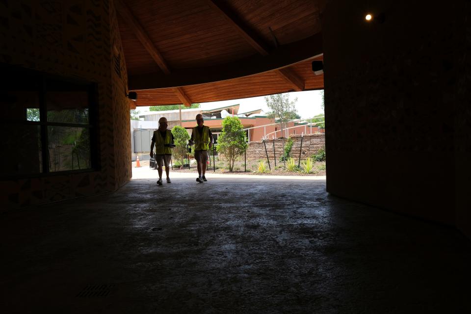Workers walk through the Expedition Africa habitat that's under construction at the Oklahoma City Zoo on Tuesday, June 6, 2023. The zoo has delayed the planned grand opening for Expedition Africa to March 2024.
