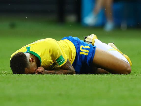 Neymar lying on the pitch.