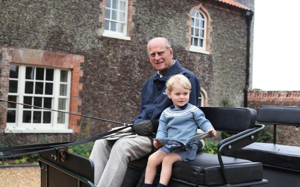 Prince Philip and Prince George sat in a horse carriage at Anmer Hall in the village of Anmer in Norfolk - The Duchess of Cambridge