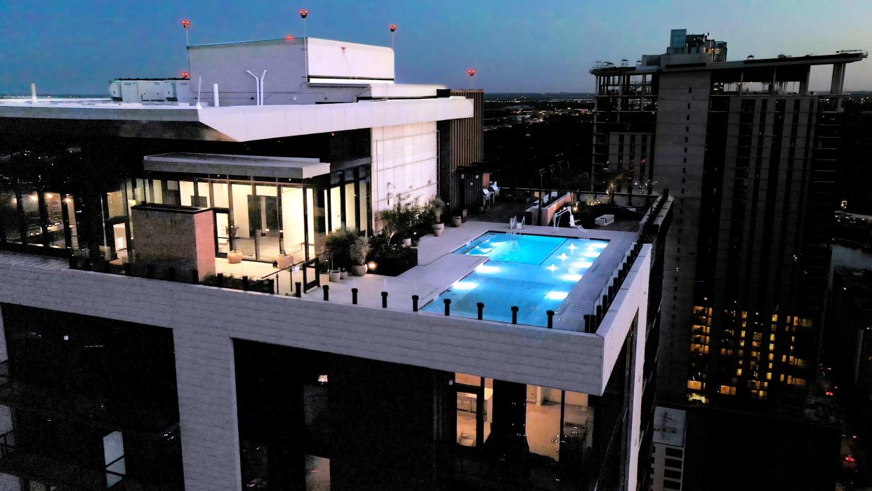 Vesper's amenities include a rooftop swimming pool and lounge, a fitness center, co-working spaces, a dog park and washing station, and a 24-hour concierge.