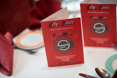 A vegan menu sits on the table of the City Spice curry house restaurant on Brick Lane in London, Britain January 7, 2019. Picture taken January 7, 2019. REUTERS/Simon Dawson