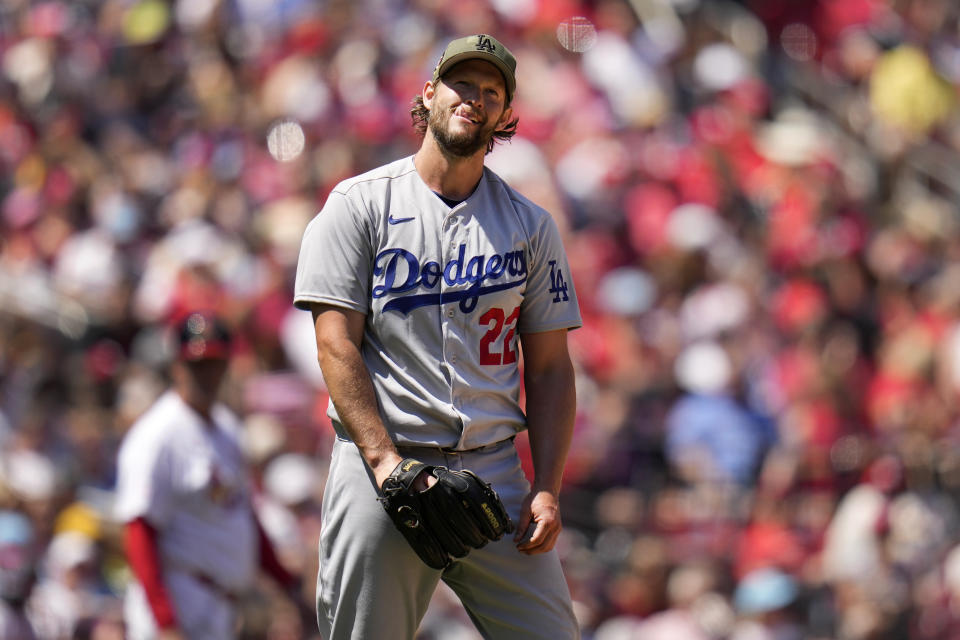 Los Angeles Dodgers starting pitcher Clayton Kershaw pauses after walking St. Louis Cardinals' Lars Nootbaar to load the bases during the fourth inning of a baseball game Sunday, May 21, 2023, in St. Louis. (AP Photo/Jeff Roberson)